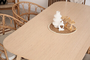 Poster - Vase, statuette and jars on wooden table in dining room