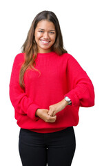 Sticker - Young beautiful brunette woman wearing red winter sweater over isolated background Hands together and fingers crossed smiling relaxed and cheerful. Success and optimistic