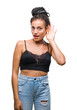 © Krakenimages.com - Young braided hair african american with pigmentation blemish birth mark over isolated background smiling with hand over ear listening an hearing to rumor or gossip. Deafness concept.