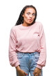 © Krakenimages.com - Young braided hair african american girl wearing sweater over isolated background making fish face with lips, crazy and comical gesture. Funny expression.
