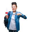 © Krakenimages.com - Young braided hair african american student girl holding degree over isolated background with surprise face pointing finger to himself