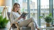 © Htet Wai Phyo - Middle aged relaxed  pretty woman reading sitting on chair at home. Happy positive beautiful lady feeling joy enjoying wellbeing and lounge chilling near window in modern cozy apartment interior