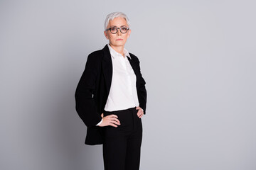 Poster - Photo portrait of attractive mature woman professional confident ceo dressed formalwear specs isolated on gray color background