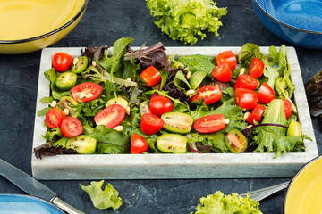 Canvas Print - Fresh green salad with cherry tomatoes.