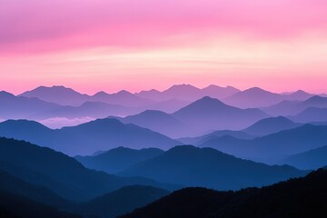 a pink and blue sky over a mountain range