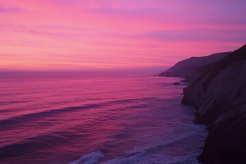 Wall Mural - a pink and purple sunset over the ocean