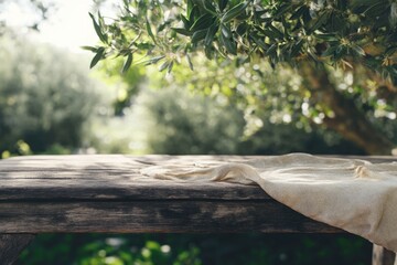 Outdoor summer scene with rustic wooden table and olive tree.