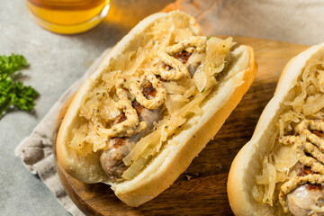 Wall Mural - German Homemade Bratwurst Sandwiches with Sauerkraut