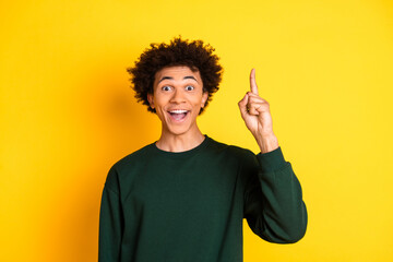 Canvas Print - Photo of nice young man point finger wear pullover isolated on yellow color background