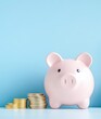 © Blue Ha Waii - AI - A pink piggy bank beside stacks of coins on a blue background, symbolizing savings, finance, and money management.