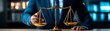 © Tanongsak idea photo - A businessman in a suit adjusting a golden balance scale in an office setting, symbolizing justice and fairness in the professional world.