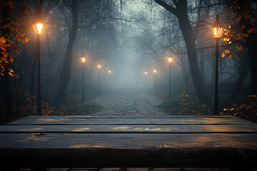 Wooden table on the background of the evening foggy park
