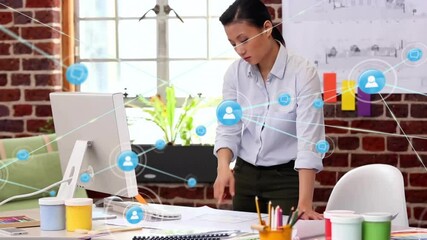 Poster - Animation of network of connections with icons over biracial businesswoman using computer