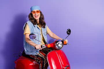 Sticker - Photo portrait of pretty retired woman ride motorbike wear trendy denim hipster outfit isolated on violet color background