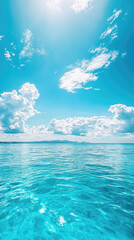 Wall Mural - A serene ocean view under clear blue sky with scattered clouds