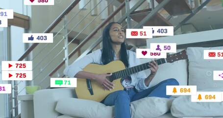 Poster - animation of media icons over biracial woman playing guitar on couch