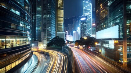 Canvas Print - A vibrant cityscape at night showcasing illuminated skyscrapers and busy traffic.