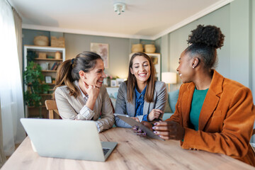 Wall Mural - Diverse Female Entrepreneurs Working at Home