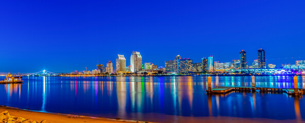 Wall Mural - Downtown San Diego at night with reflections on the water