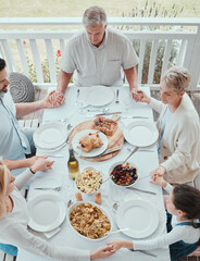 Canvas Print - Prayer, food and family holding hands in home for celebration or festive holiday vacation. Above meal, roast and lunch with people eating in house together for party event or social gathering reunion