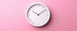 © ParinApril - A minimalist white clock against a soft pink background, symbolizing time management and elegance in design.