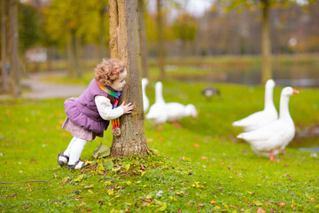 Wall Mural - Kids playing in autumn park