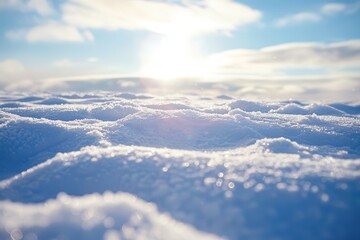 Poster - Snow-covered hills stretch across the landscape under a clear blue sky, creating a serene winter scene in a peaceful, rural area