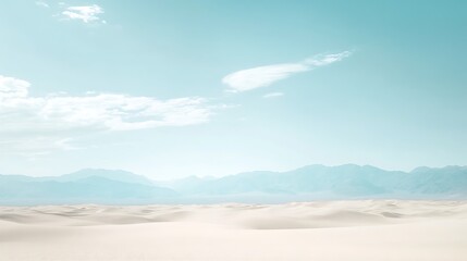 A soft, blurred desert landscape with a large, clear sky for text