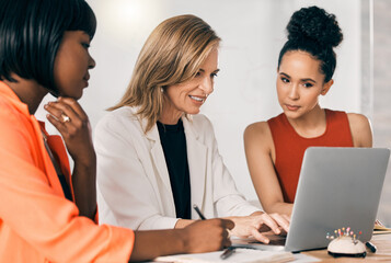 Canvas Print - Business people, laptop and women in meeting, brainstorming in office and cooperation. Employees, teamwork or fashion journalist with documents, magazine agency or creativity for project or computer