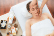 © Summit Art Creations - Caucasian woman enjoying relaxing anti-stress head massage and pampering facial beauty skin recreation leisure in dayspa modern light ambient at luxury resort or hotel spa salon. Quiescent
