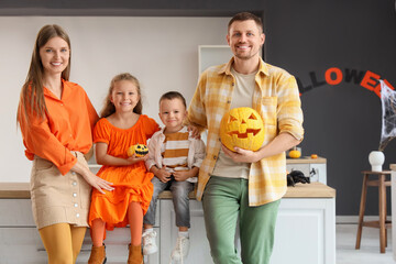 Poster - Happy family with Halloween pumpkins in kitchen