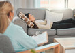 © peopleimages.com - Counseling, woman and therapist on couch for consultation, mental health or anxiety support in office. Therapy, female patient or psychologist on sofa for discussion, share trauma or story in session
