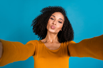 Canvas Print - Photo portrait of nice young lady take selfie photo kissing lips dressed stylish yellow garment isolated on blue color background