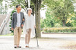 © buritora - 公園を話しながら歩く日本人の高齢者夫婦（シニア・男女）