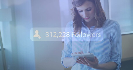 Poster - 205,584 followers image over woman using tablet in office
