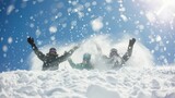Friends enthusiastically celebrate their snowboarding adventure, throwing snow into the air on a sunny winter day