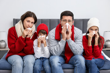 Canvas Print - Cold symptom. Family suffering from fever on bed at home