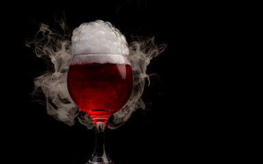 Wine glass filled with red liquid with strange swirling fog and smoke creating bubbles, shapes and patterns