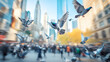 © Thanapon - A flock of pigeons taking off in flight from a busy city square with skyscrapers and blurred crowds in the background