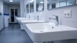 © Yusif - A sleek, white modern sink in a medical clinic, featuring a clean and hygienic design.