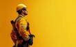 © Dai - Side view of a construction worker wearing safety gear and holding a wrench. Isolated on a simple background with open space on the right for text