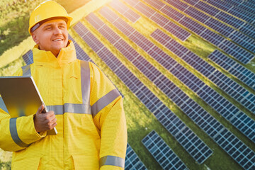 Worker examining solar panels on a sunny day