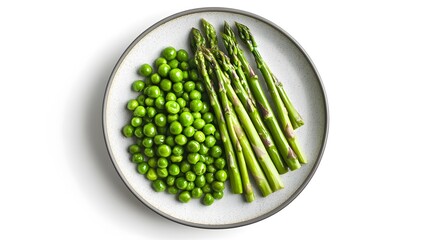 Fresh green plate: asparagus and peas on minimalist white background