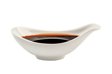 A white porcelain dish containing dark soy sauce isolated on white transparent background.