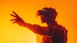 © Snowstudio - Black man in VR headset is reaching out to touch something in the air, surrounded by orange light