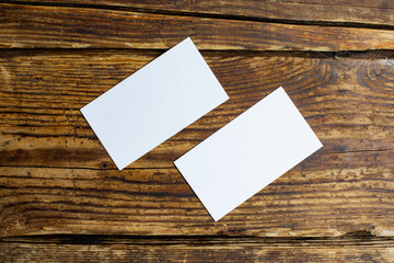 Paper sheet cards with blank mockup copy space on wood background 