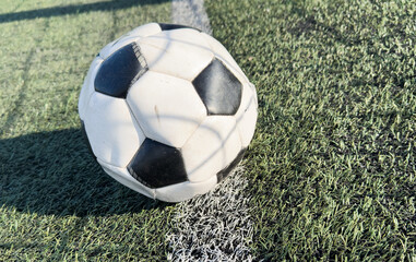 Wall Mural - top view of football on green field , soccer ball on grass