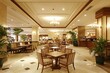 © Naseem - Cozy and welcoming hotel lobby cafe for casual meetings.