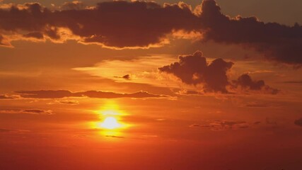 Wall Mural - Sunset with dramatic clouds in orange sky. Nature time lapse. Twilight sky landscape for design and print, timelapse.