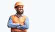 © Prostock-studio - Happy African Builder Workman Standing Pleased Crossing Hands Posing On White Studio Background. Panorama, Copy Space